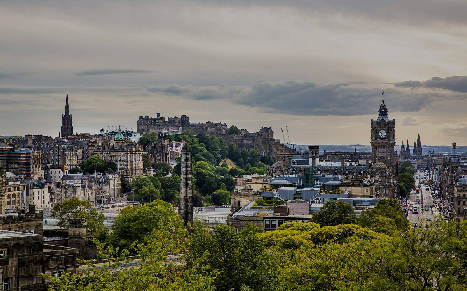 Aerial view of Edinburgh featuring Edinburgh Castle and the Balmoral Clock Tower.
