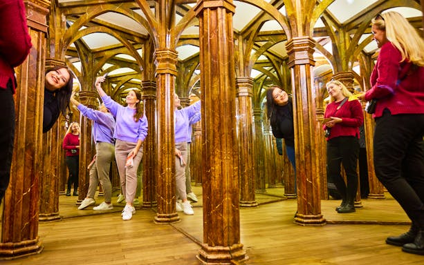 Visitors exploring a mirror maze in Prague with the 48/72/120 Hours Visitor Pass.