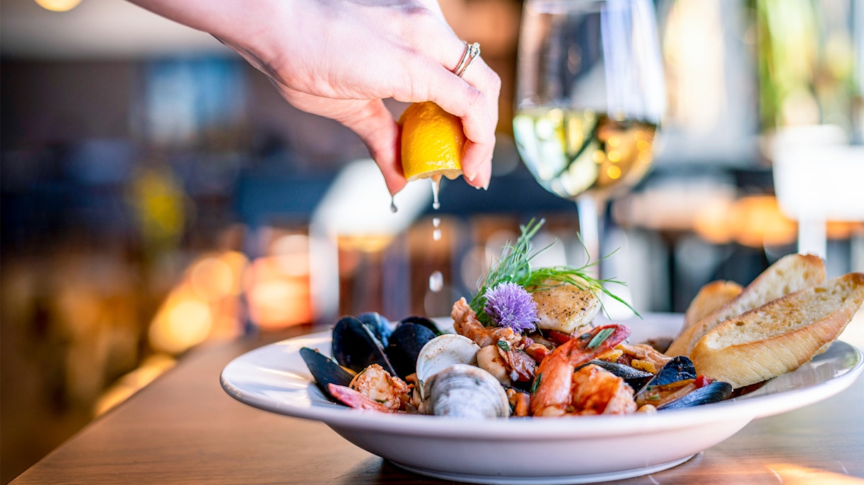 Seville tapas tasting with local guide in traditional Spanish bar.