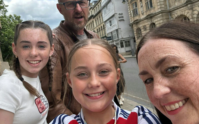 Family enjoying Oxford city exploration game near Old Bank Hotel.