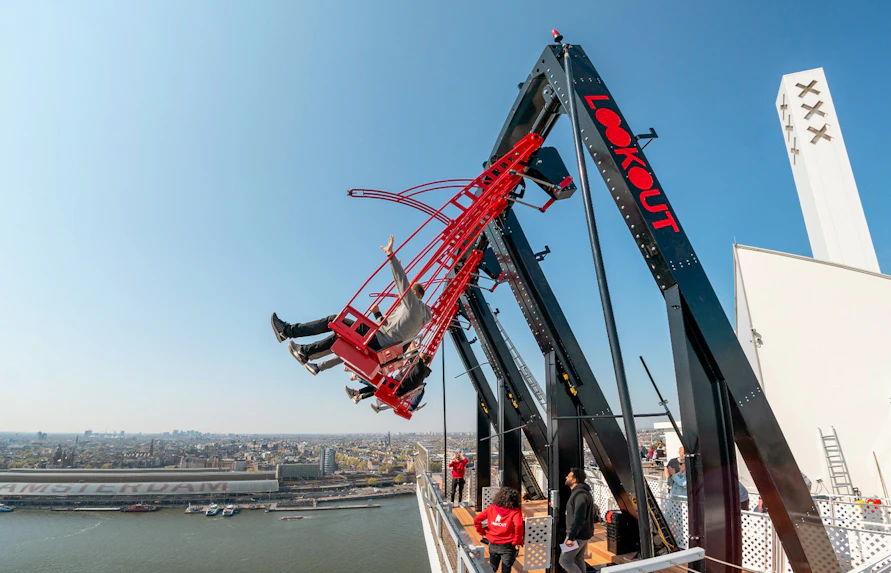 ADAM Lookout Swing over Amsterdam skyline with people enjoying the view.