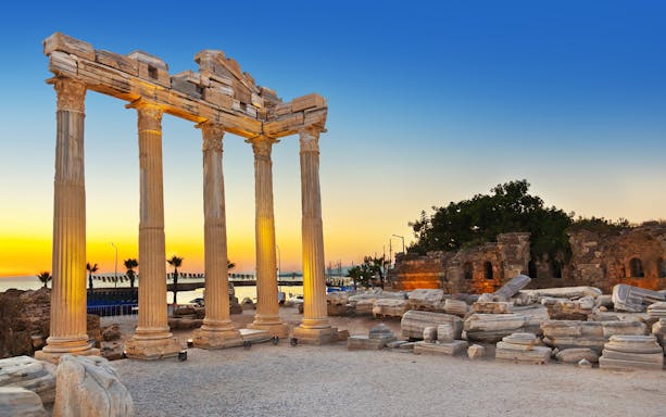 Ancient columns of the Temple of Apollo at sunset in Side, Turkey.