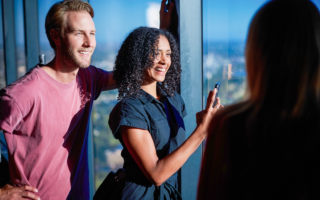 Visitors enjoying the view from Melbourne Skydeck at Eureka Tower.