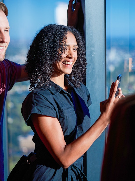 Visitors enjoying the view from Melbourne Skydeck at Eureka Tower.
