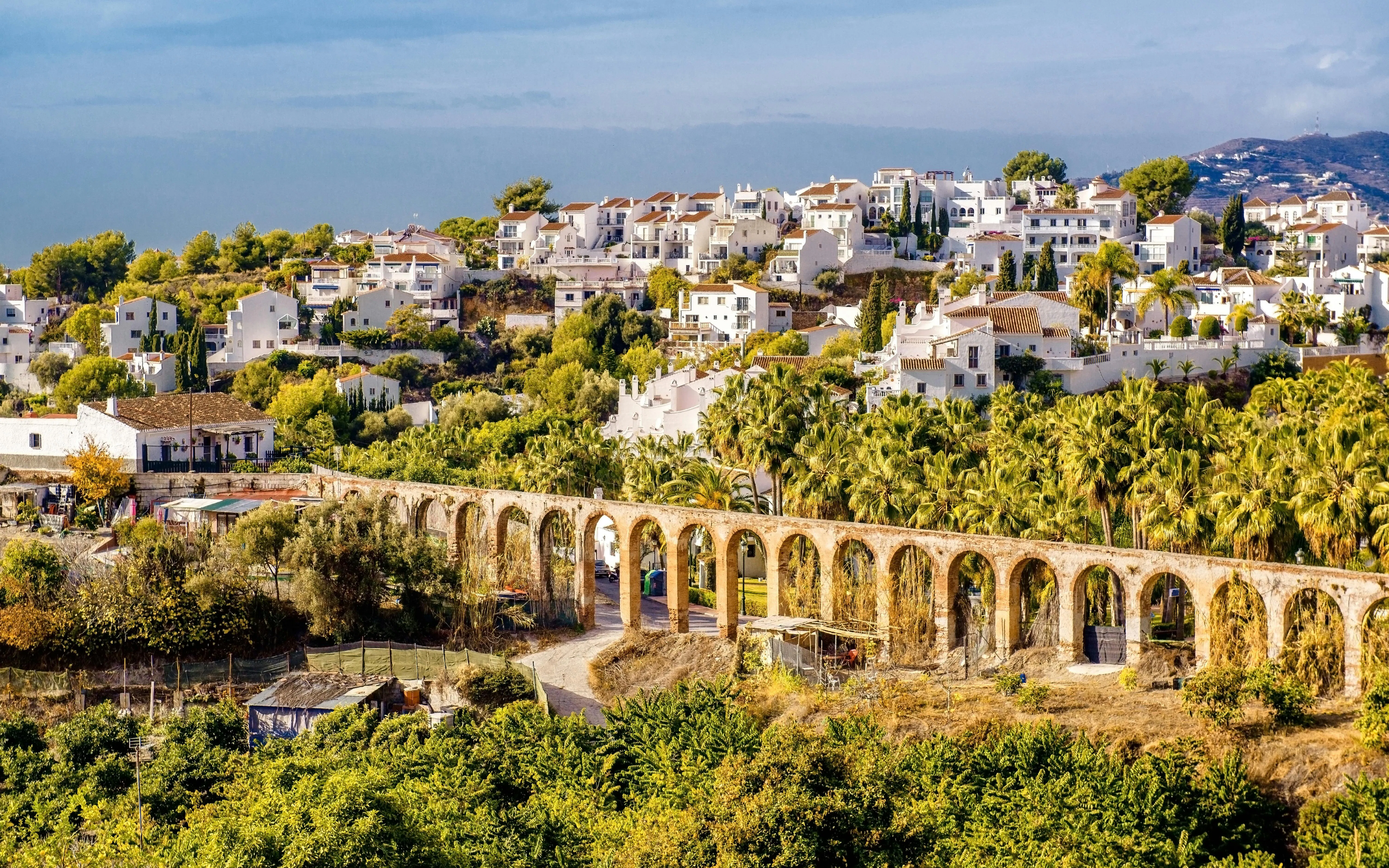 Nerja landscape with historic aqueduct and white houses, Province of Malaga, southern Spain.