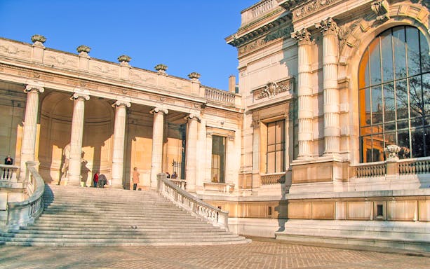 Palais Galliera corridors with elegant arches and historic architecture in Paris, France.