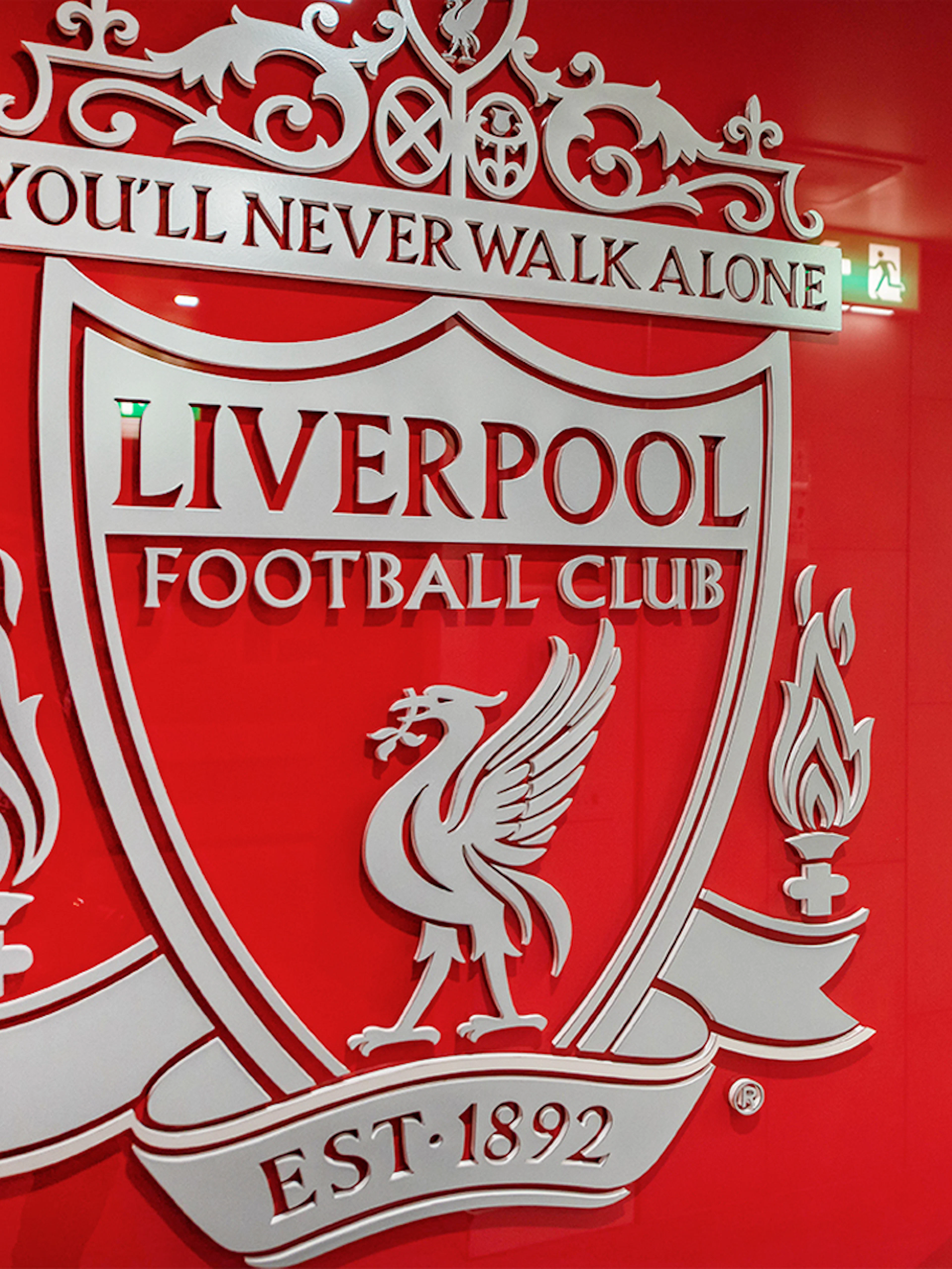 Liverpool FC crest on stadium tour entrance wall.