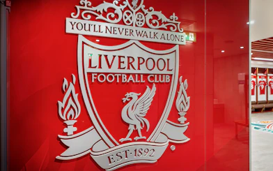 Liverpool FC crest on stadium tour entrance wall.