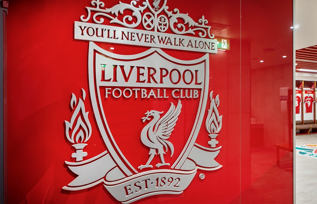 Liverpool FC crest on stadium tour entrance wall.