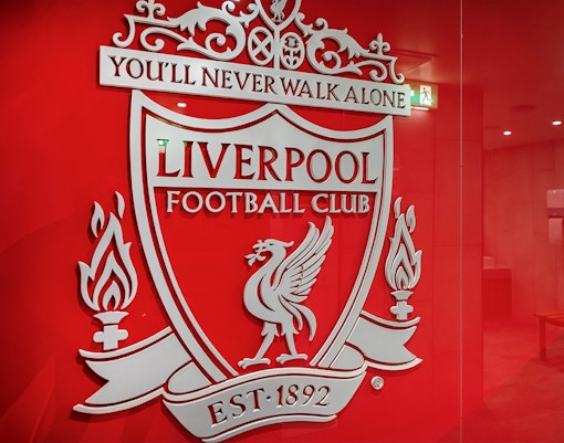 Liverpool FC crest on stadium tour entrance wall.