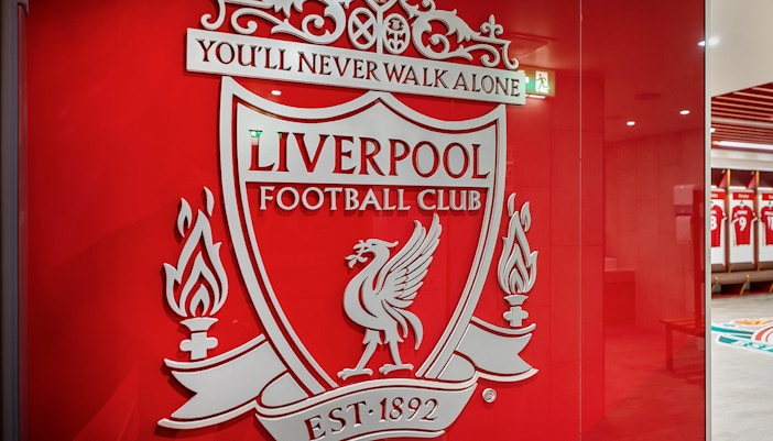 Liverpool FC crest on stadium tour entrance wall.