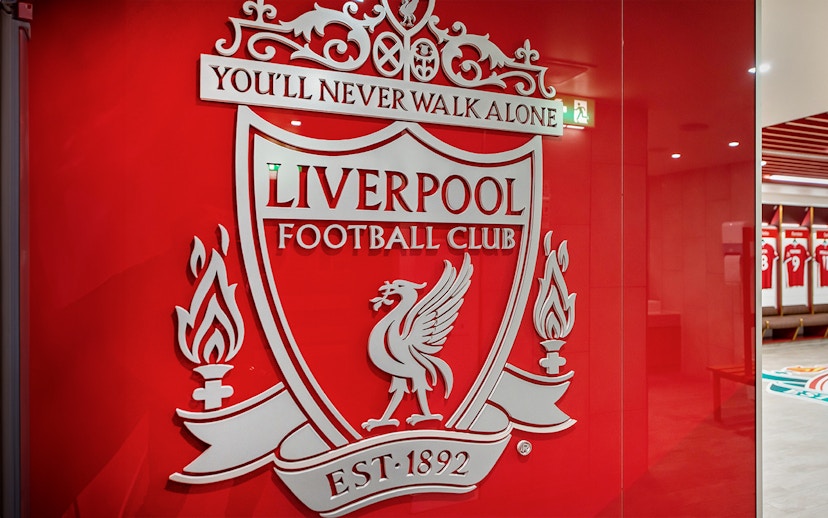 Liverpool FC crest on stadium tour entrance wall.