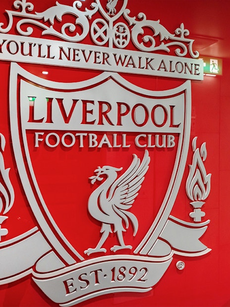 Liverpool FC crest on stadium tour entrance wall.