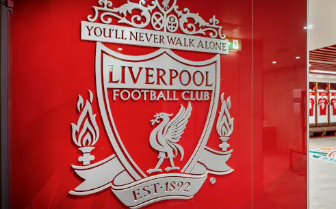 Liverpool FC crest on stadium tour entrance wall.