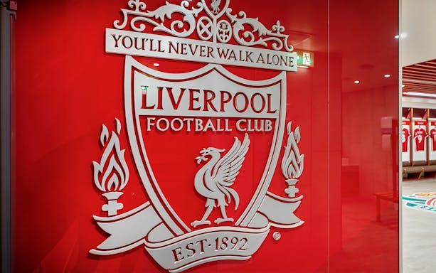 Liverpool FC crest on stadium tour entrance wall.