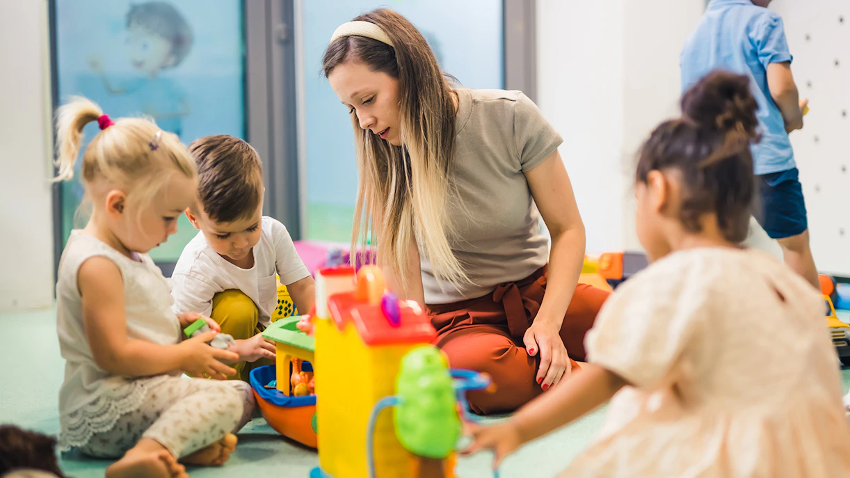 Children playing with toys in Kids Club Playhouse.