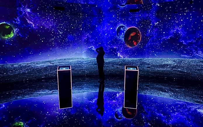 Tourist exploring space-themed exhibit at MIRACLEWORLD Osaka.