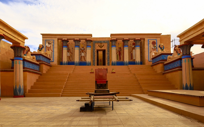 Ancient Egyptian set at Atlas Studios in Ouarzazate, Morocco, featuring columns and statues.