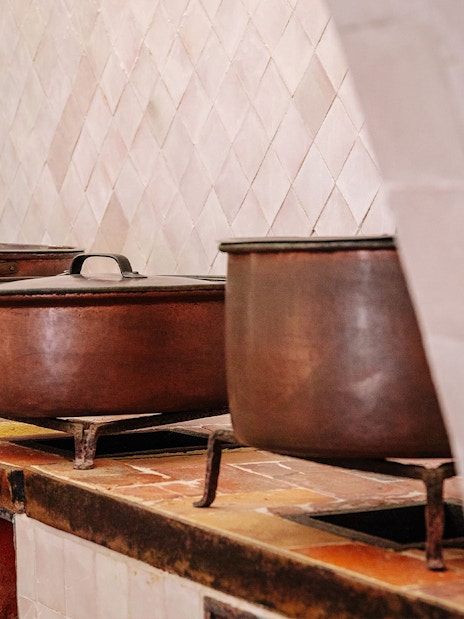 Copper pots in the historic kitchen of Sintra National Palace, Portugal.