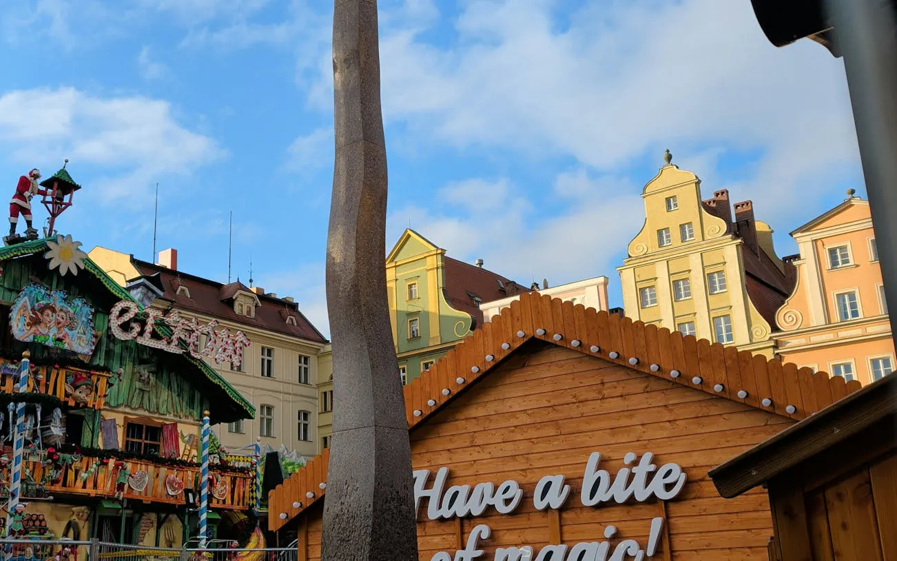 Colorful buildings and festive decorations in Wroclaw's Old Breslau during a city exploration game.