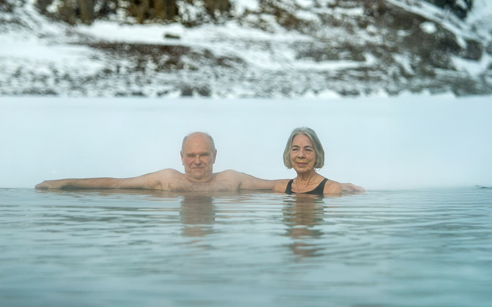Guests enjoying the geothermal waters at Vok Baths, Iceland.