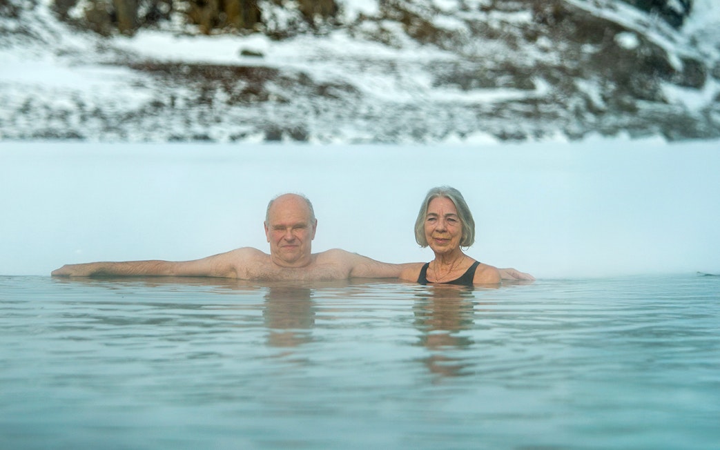 Guests enjoying the geothermal waters at Vok Baths, Iceland.