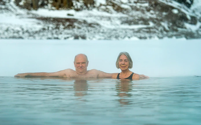 Guests enjoying the geothermal waters at Vok Baths, Iceland.