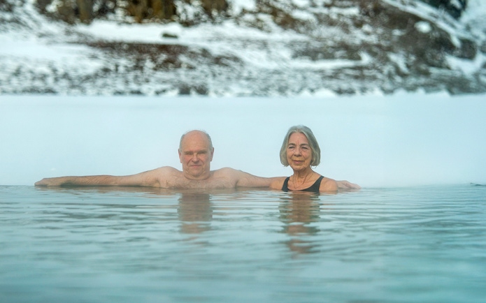 Guests enjoying the geothermal waters at Vok Baths, Iceland.