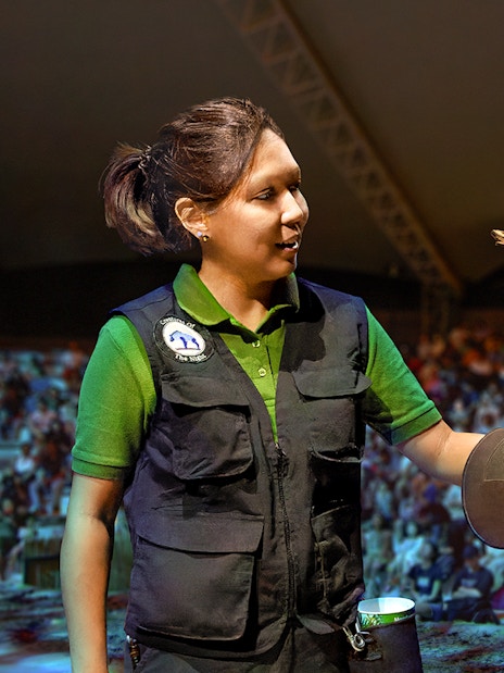 Handler with owl during live show at Night Safari, Singapore.