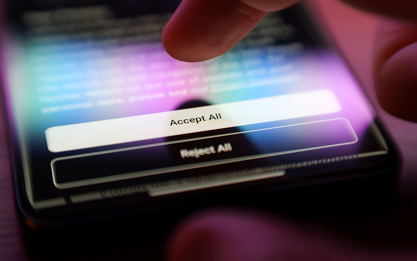 Accepting terms on a smartphone screen with a finger tapping "Accept All".