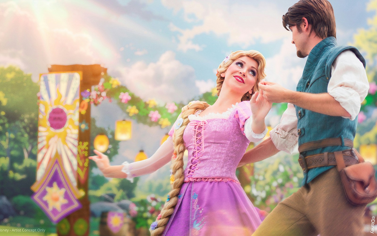 Rapunzel and Flynn dancing at Disneyland Paris with lanterns and floral backdrop.