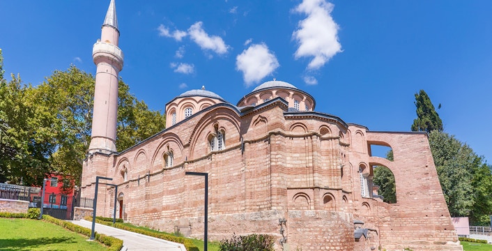 Kariye Mosque exterior with minaret and domes in Istanbul.