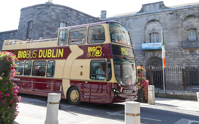 Double-decker tour bus in front of Kilmainham Gaol, Dublin.