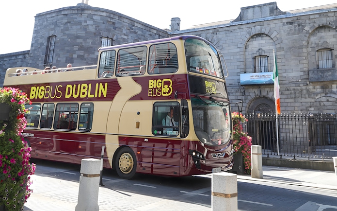Double-decker tour bus in front of Kilmainham Gaol, Dublin.