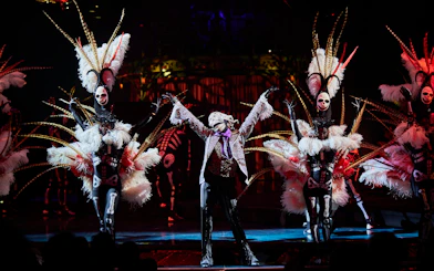 Kooza Brisbane show performers in elaborate costumes on stage.