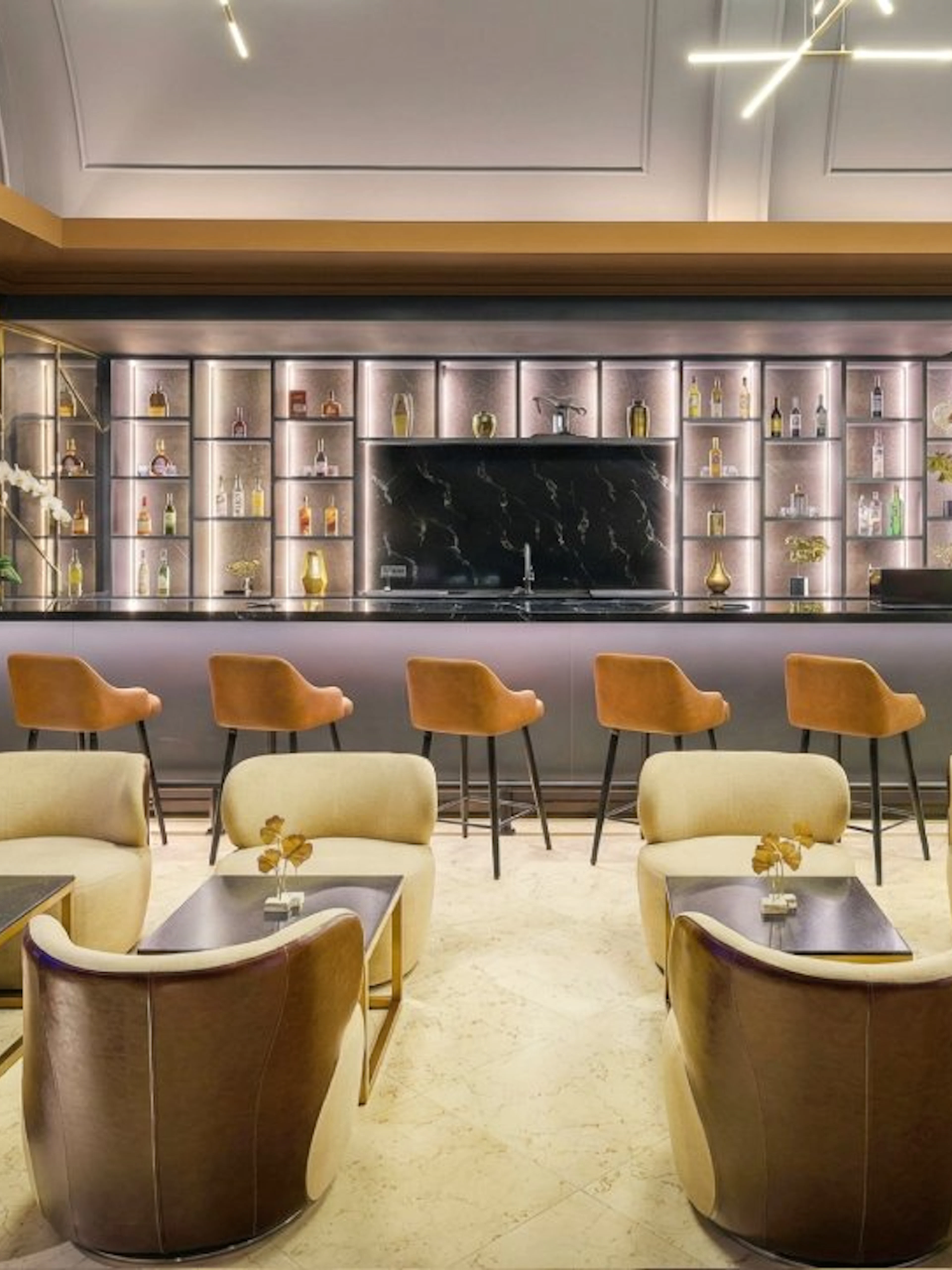 Sky Suite Airport Lounge with seating, bar, and elegant decor in Terminal 1 & 2.