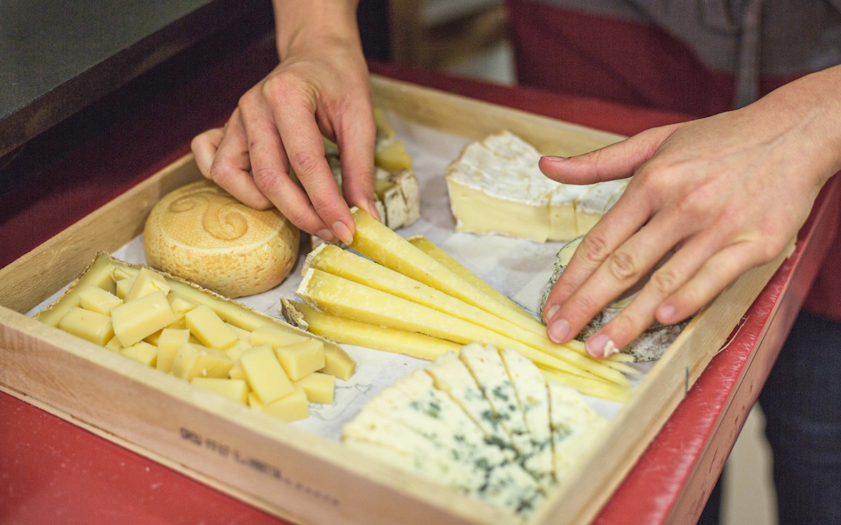 Cheese selection on a tray at the Cheese Museum in Paris, France.