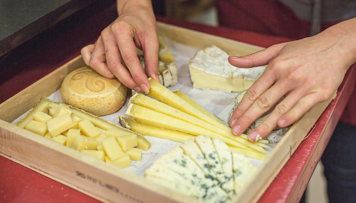 Cheese selection on a tray at the Cheese Museum in Paris, France.