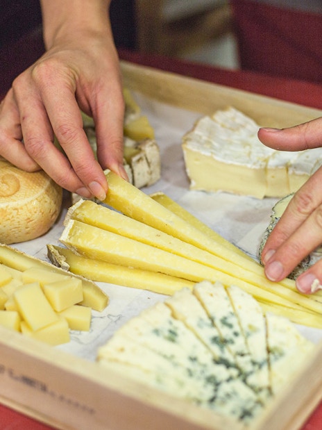 Cheese selection on a tray at the Cheese Museum in Paris, France.