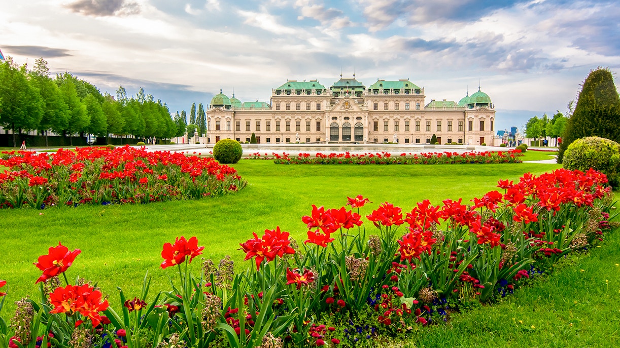 Belvedere Palace gardens with manicured lawns and ornate fountains in Vienna, Austria.