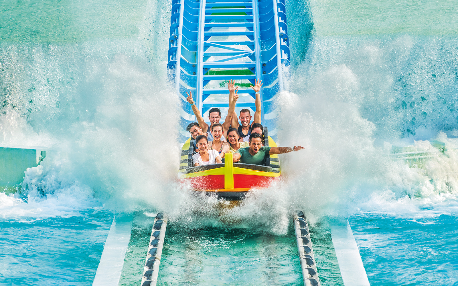 People enjoying a water ride at Desaru Waterpark, Malaysia.