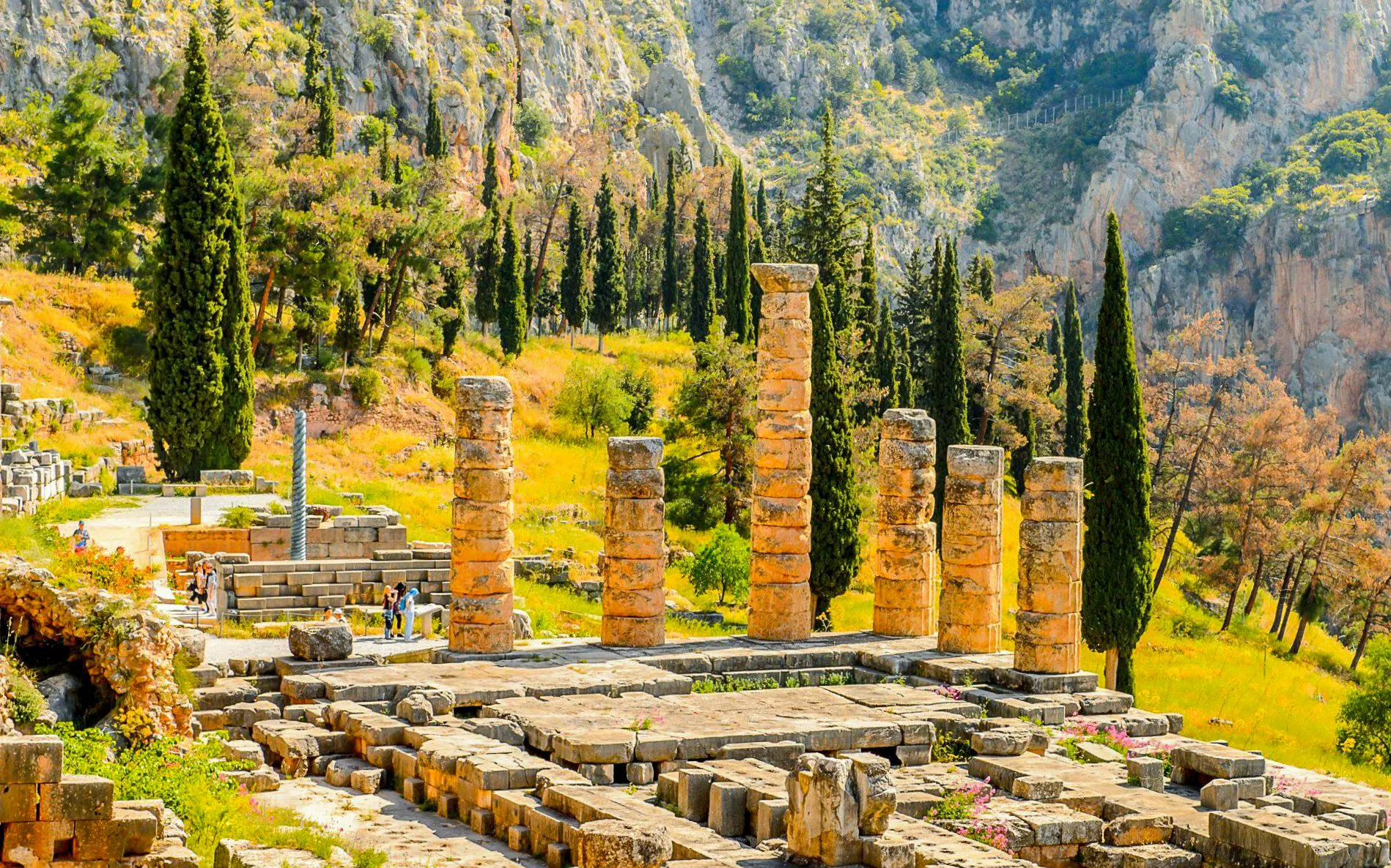 Temple of Apollo ruins at Delphi Archaeological Site with surrounding landscape, near Athens.