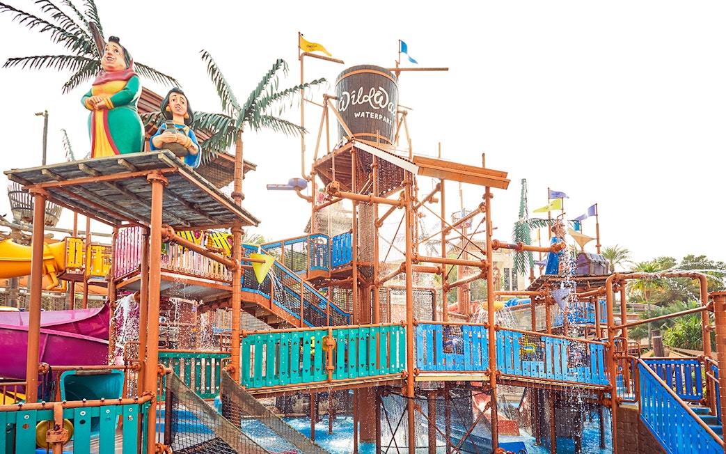 Visitors enjoying water rides at Wild Wadi Water Park, Dubai.