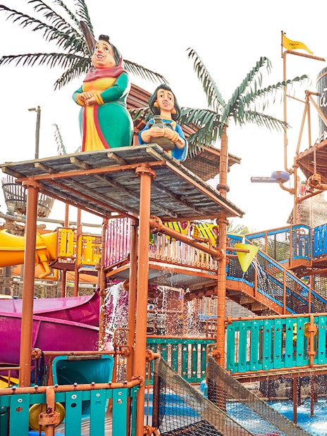 Visitors enjoying water rides at Wild Wadi Water Park, Dubai.