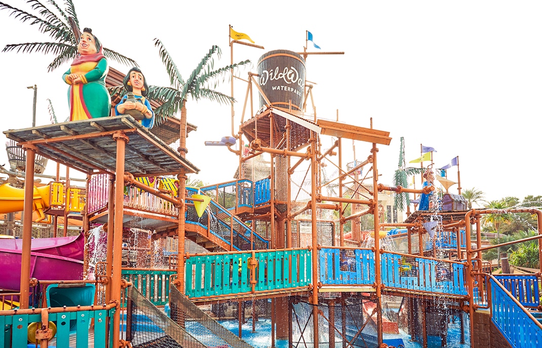 Visitors enjoying water rides at Wild Wadi Water Park, Dubai.