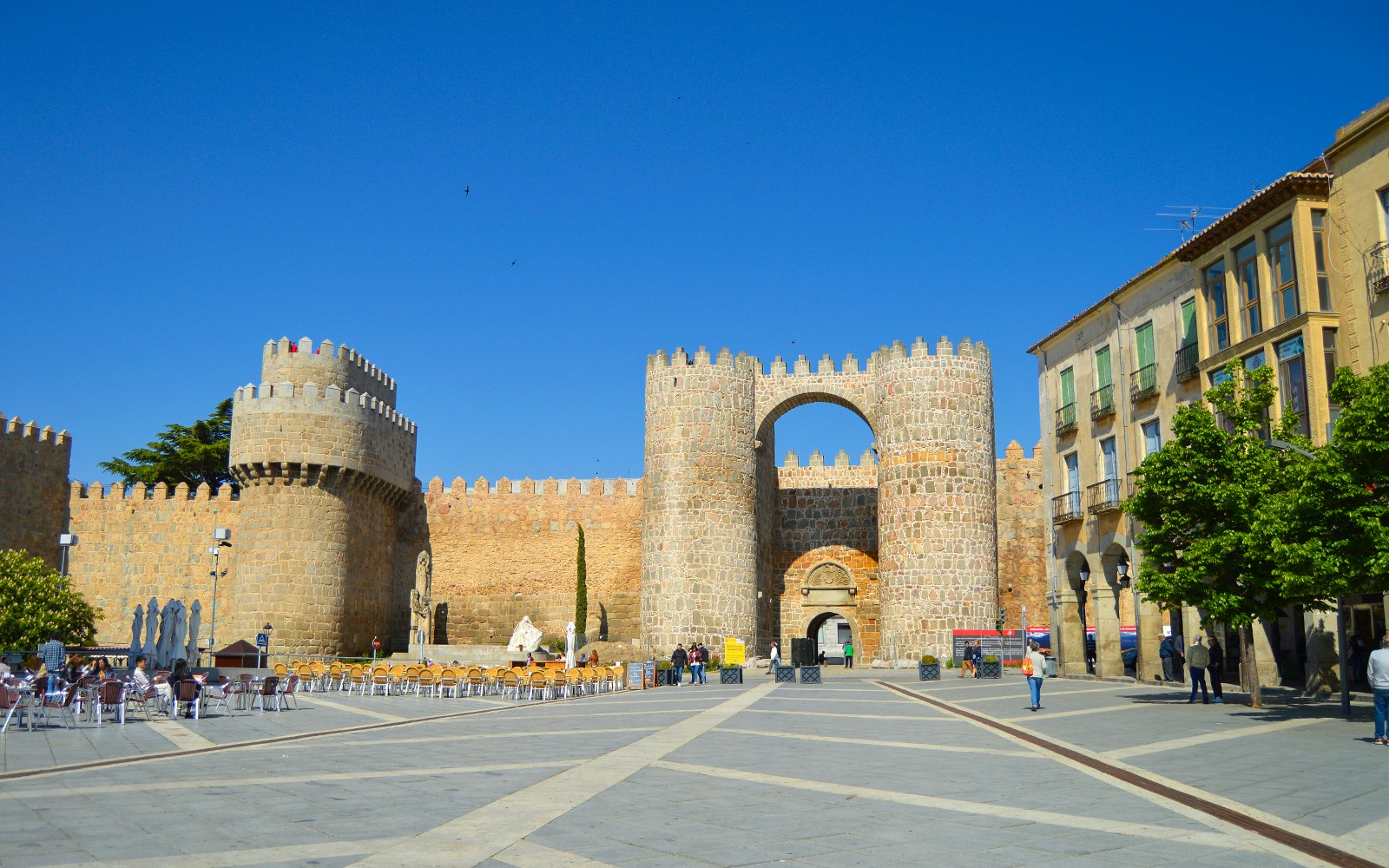 Plaza del Mercado Grande with Puerta del Alcázar gate in Avila, Spain.