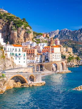 Colorful cliffside buildings in Sorrento overlooking the sea, part of Rome to Sorrento tours.