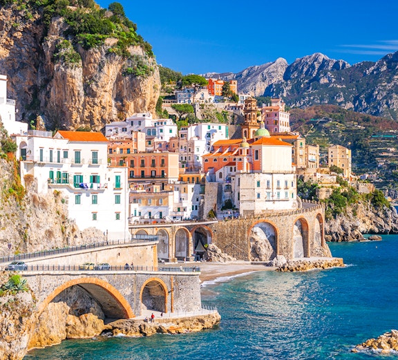 Colorful cliffside buildings in Sorrento overlooking the sea, part of Rome to Sorrento tours.