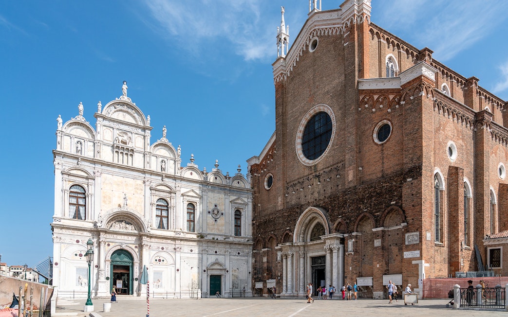 Facade of Santi Giovanni e Paolo Basilica in Venice during a walking tour.
