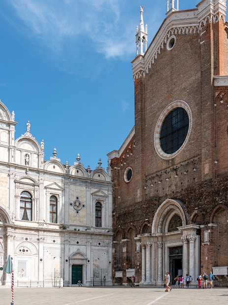 Facade of Santi Giovanni e Paolo Basilica in Venice during a walking tour.